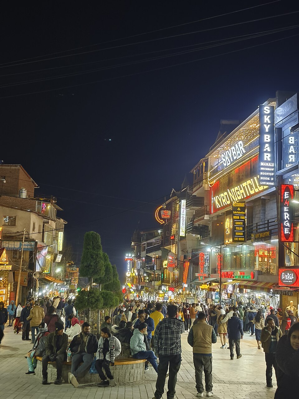 Mall Road, Manali - busy shopping street at night with shops and restaurants